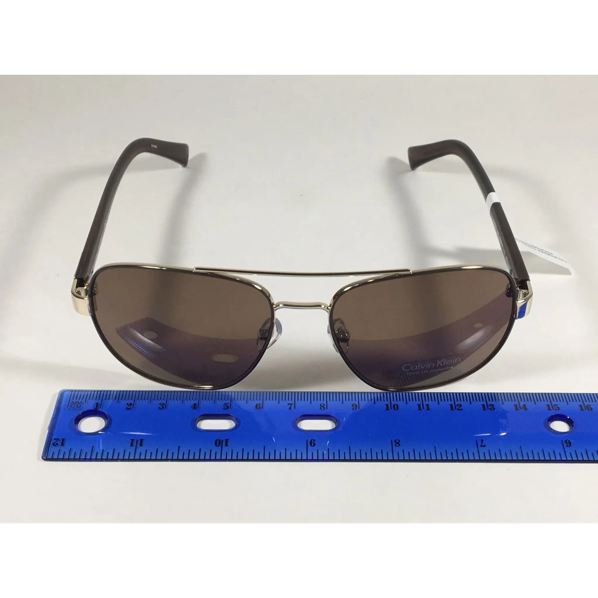 Calvin Klein R357S 210 Aviator Pilot Sunglasses Gold And Brown Frame With Brown Lens